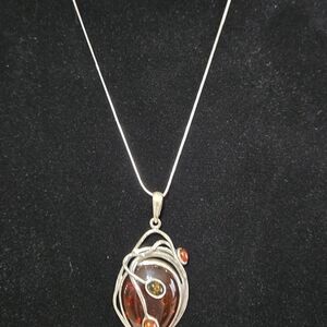 Elegant Silver and Amber Pendant Necklace